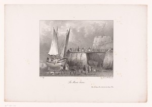 Vissersboot aan de kade bij eb