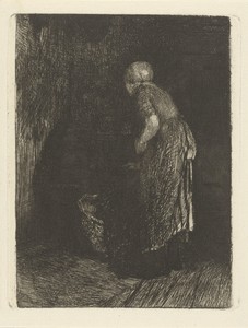 Vrouw kijkt in een wieg