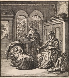 Vrouw naast een wieg waarin een baby ligt