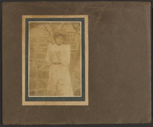 [Woman Holding Flower in Garden]