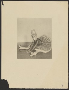 [Woman in Can Can Costume Seated on Floor with Legs Spread Apart]