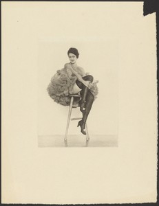 [Woman in Can Can Costume Seated on Stool]