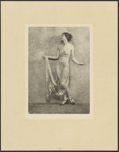 [Woman in Elegant Dress Standing in Profile]