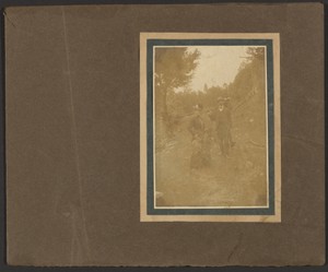 [Woman with Branches and Man with Camera]