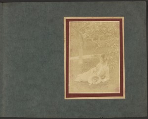 [Woman with Hat Full of Apples in Garden]