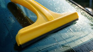 Yellow Squeegee on Car