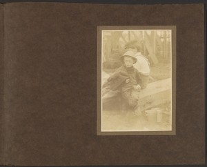 [Young Boys Sitting on Bench with Pails]