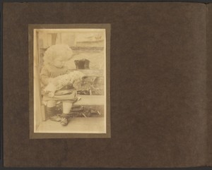 [Young Girl Holding Doll]