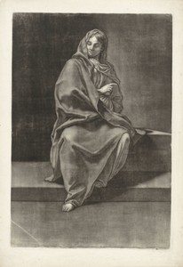 Zittende vrouw in een lange mantel